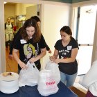 Student volunteers getting the take-out orders ready to go.